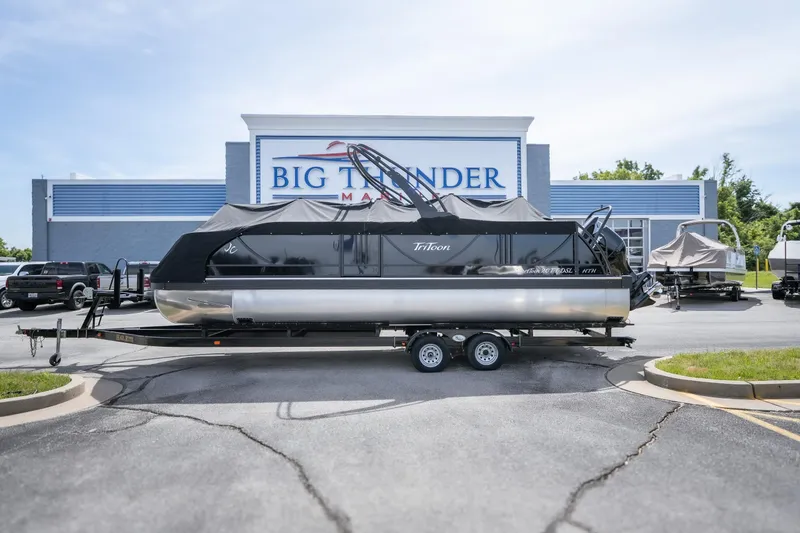 The Image of 2026 JC Sporttoon 26TT pontoon boat on trailer at Big Thunder Marine dealership. - 1