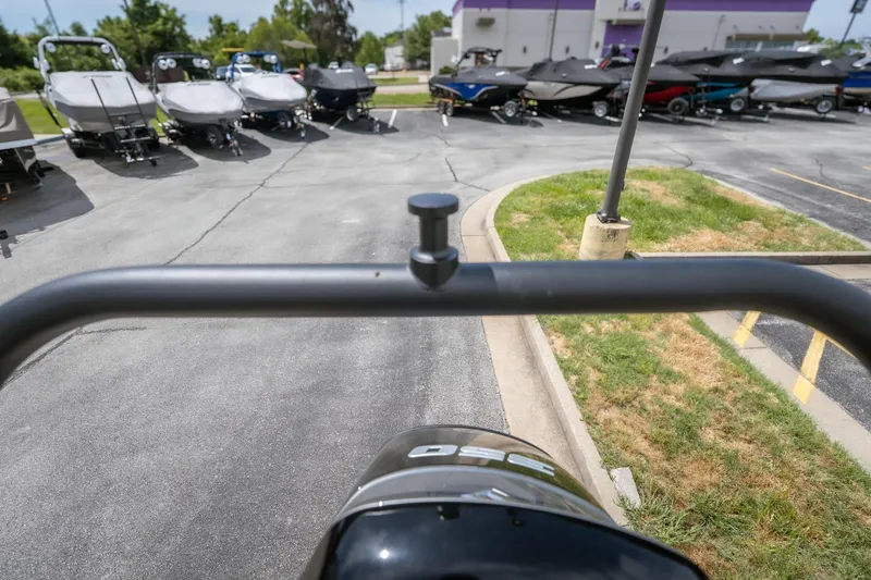 Slide: The Image of Outdoor view of JC Sporttoon 26TT boat, 2026 model, in a parking lot with other boats. - 14