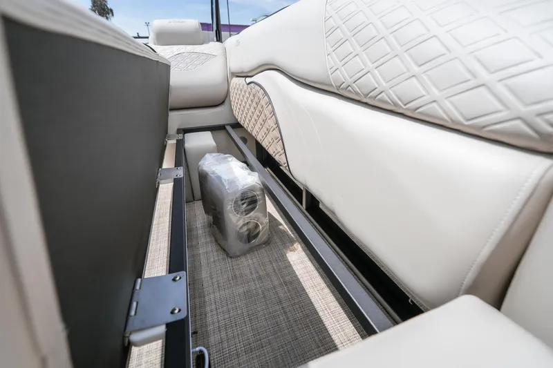 Slide: The Image of Interior view of 2026 JC Sporttoon 26TT boat with luxurious seating and storage space. - 31