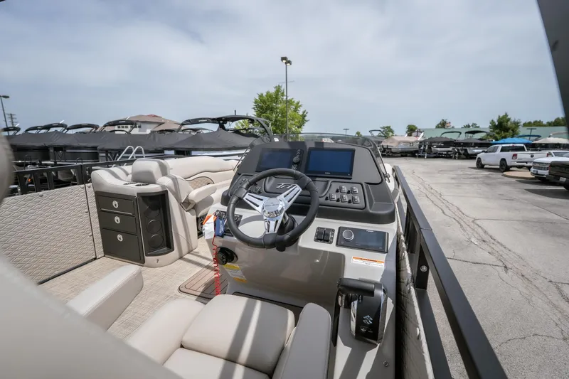 Slide: The Image of Interior view of 2026 JC Sporttoon 26TT boat with modern dashboard and seating. - 32