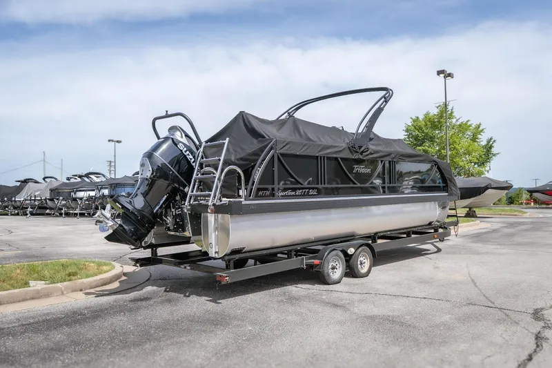 Slide: The Image of 2026 JC Sporttoon 26TT pontoon boat on trailer, covered and parked outdoors. - 36