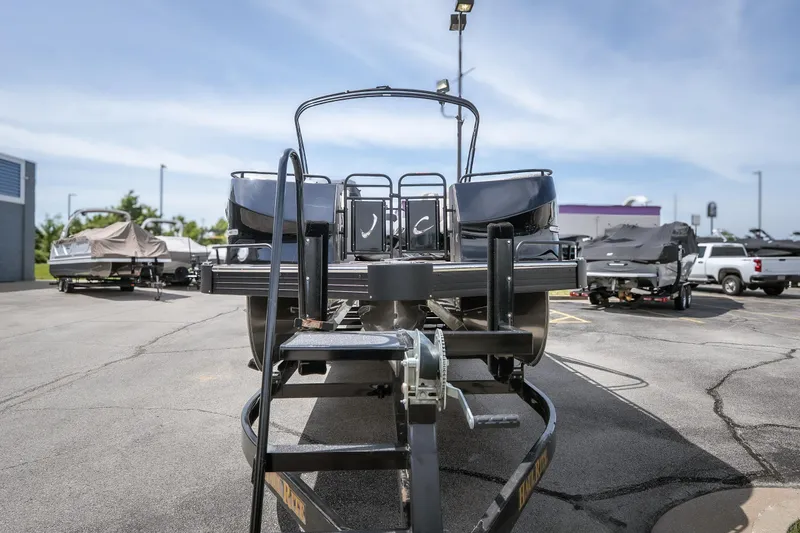 Slide: The Image of 2026 JC Sporttoon 26TT pontoon boat on trailer in parking lot. - 4