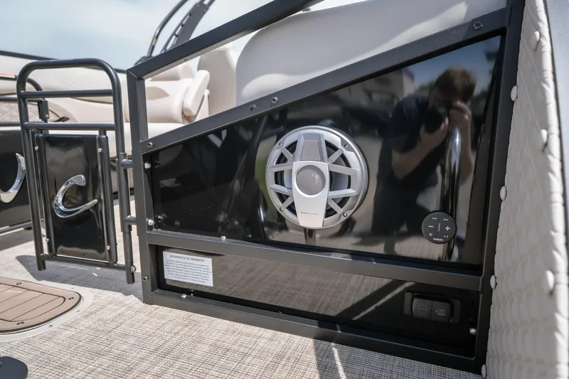 Slide: The Image of 2026 JC Sporttoon 26TT boat interior with speaker and control panel. - 8