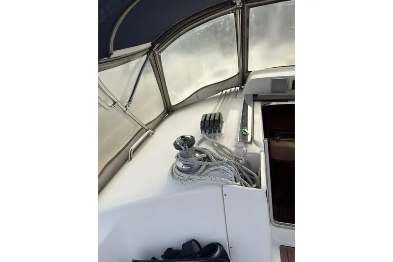 Slide: The Image of Interior view of a 2007 Hunter 38 sailboat cockpit with ropes and winch. - 13