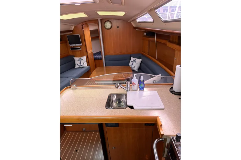 Slide: The Image of Interior of 2007 Hunter 38 sailboat with cozy seating and kitchenette. - 20