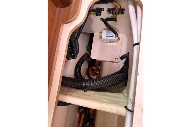 Slide: The Image of Electrical wiring and components inside a 2007 Hunter 38 boat compartment. - 28