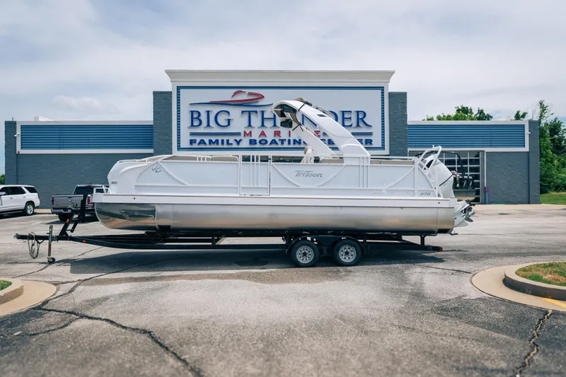 The Image of 2026 JC Sporttoon 26TT pontoon boat on trailer at Big Thunder Marine dealership. - 1