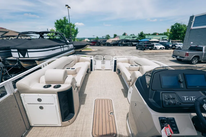 Slide: The Image of Luxurious 2026 JC Sporttoon 26TT pontoon boat interior with plush seating and modern dashboard. - 15