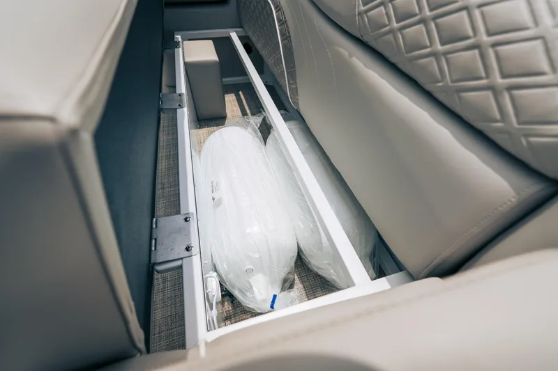 Slide: The Image of Under-seat storage in 2026 JC Sporttoon 26TT boat, featuring cushions and sleek design. - 28