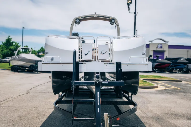Slide: The Image of 2026 JC Sporttoon 26TT pontoon boat on trailer in parking lot. - 3
