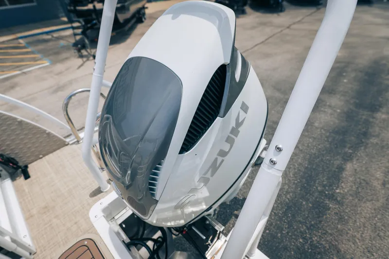 Slide: The Image of ```json { "alt_text": "2026 JC Sporttoon 26TT with Suzuki outboard motor." } ``` - 33