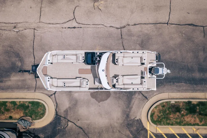 Slide: The Image of Aerial view of 2026 JC Sporttoon 26TT pontoon boat parked on pavement. - 34