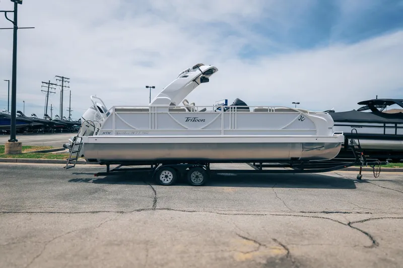Slide: The Image of 2026 JC Sporttoon 26TT pontoon boat on trailer in parking lot. - 36