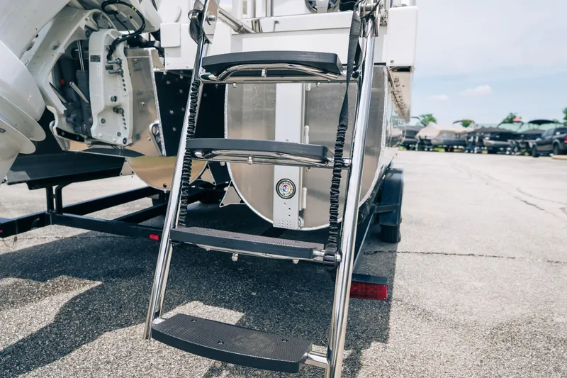 Slide: The Image of Rear view of 2026 JC Sporttoon 26TT boat ladder on trailer. - 39