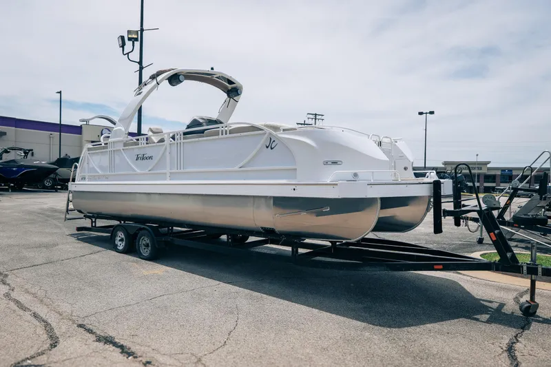 Slide: The Image of 2026 JC Sporttoon 26TT pontoon boat on trailer in parking lot. - 4