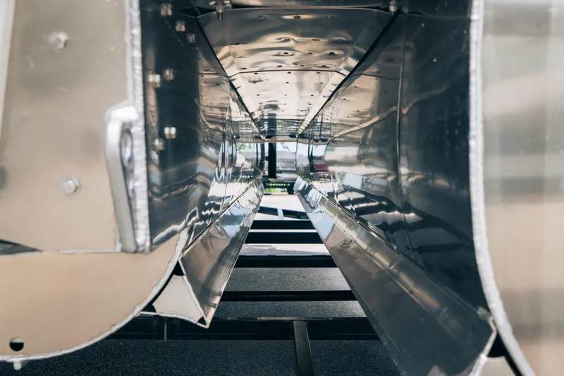 Slide: The Image of Close-up of JC Sporttoon 26TT 2026 boat hull, showcasing sleek metallic design. - 40