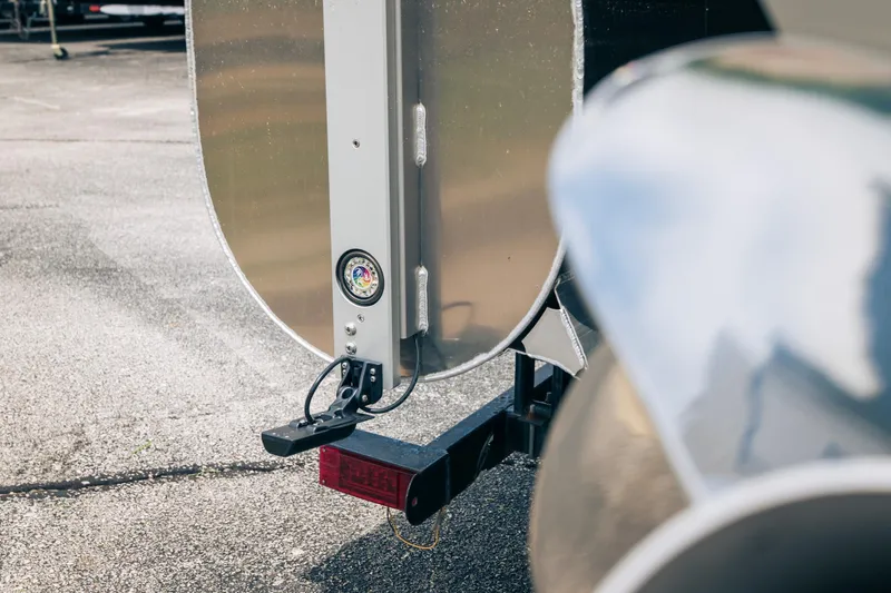 Slide: The Image of Close-up of a 2026 JC Sporttoon 26TT trailer hitch on asphalt. - 41