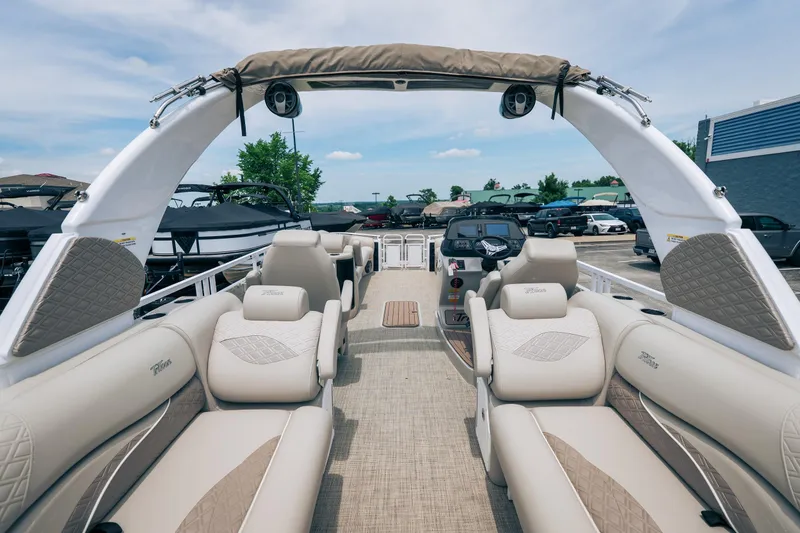 Slide: The Image of Luxurious 2026 JC Sporttoon 26TT pontoon boat interior with plush seating and modern design. - 7