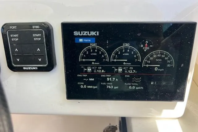 Slide: The Image of 2024 Bluewhale 3600 WA dashboard with Suzuki engine display and controls. - 14