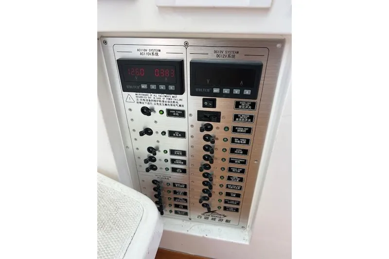 Slide: The Image of Electrical control panel on a 2024 Bluewhale 3600 WA boat, featuring AC/DC systems. - 15