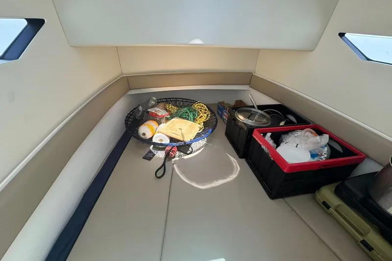 Slide: The Image of Interior of 2024 Bluewhale 3600 WA boat with storage items and supplies. - 19