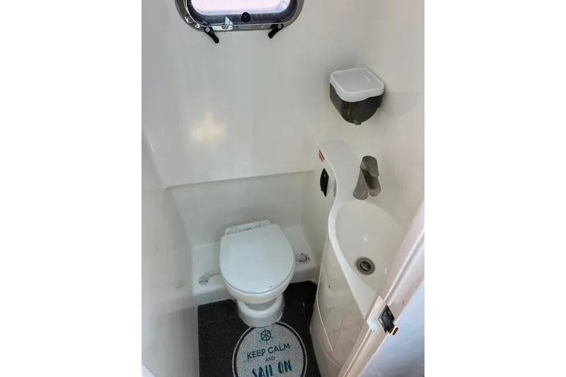 Slide: The Image of Compact marine bathroom in 2024 Bluewhale 3600 WA boat, featuring toilet and sink. - 26
