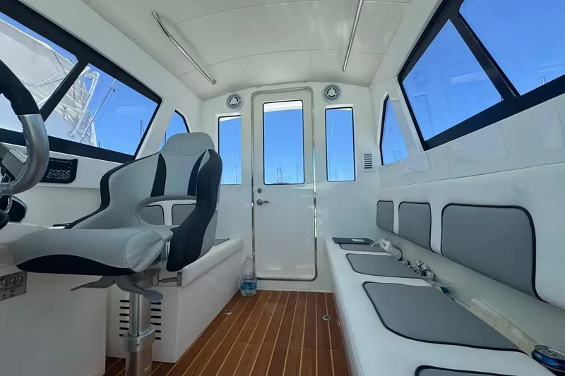 Slide: The Image of Interior of 2024 Bluewhale 3600 WA boat, featuring modern seating and sleek design. - 6