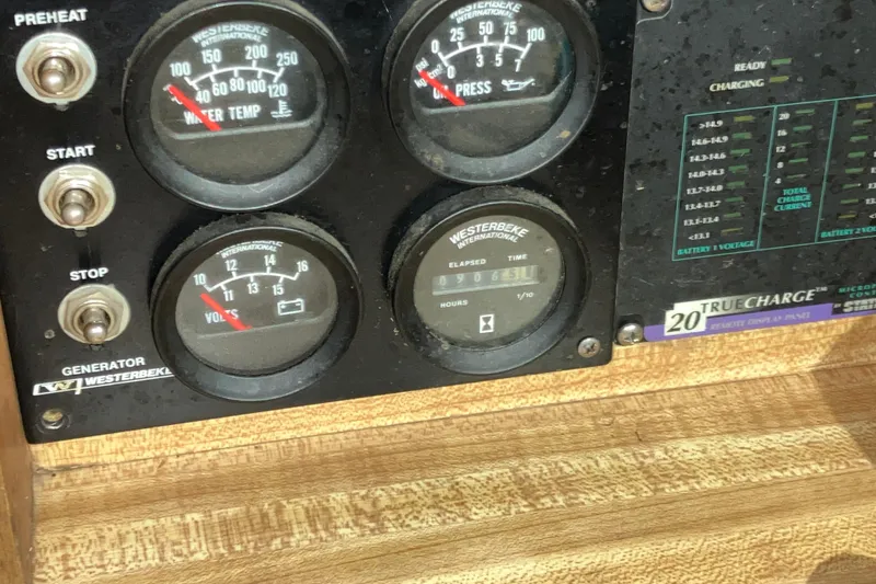 Slide: The Image of Control panel of a 1982 Trojan F-32 boat with Westerbeke gauges and switches. - 11