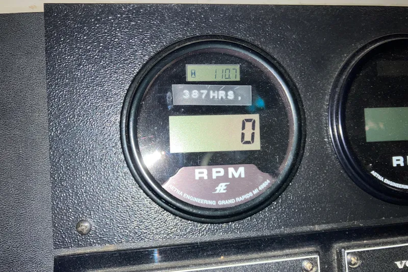 Slide: The Image of Instrument panel of a 1982 Trojan F-32 boat showing RPM and hours. - 15