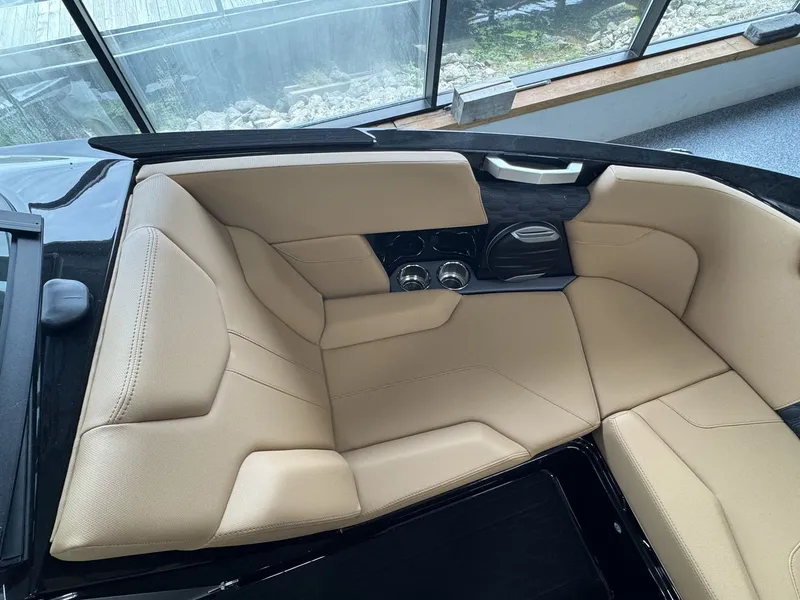 Slide: The Image of Interior of the 2026 MasterCraft XT22 with beige upholstery and modern fittings. - 25