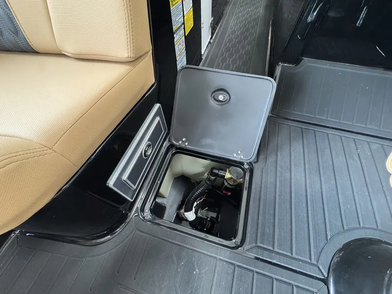 Slide: The Image of An open compartment in a boat's floor reveals a pump mechanism. - 22