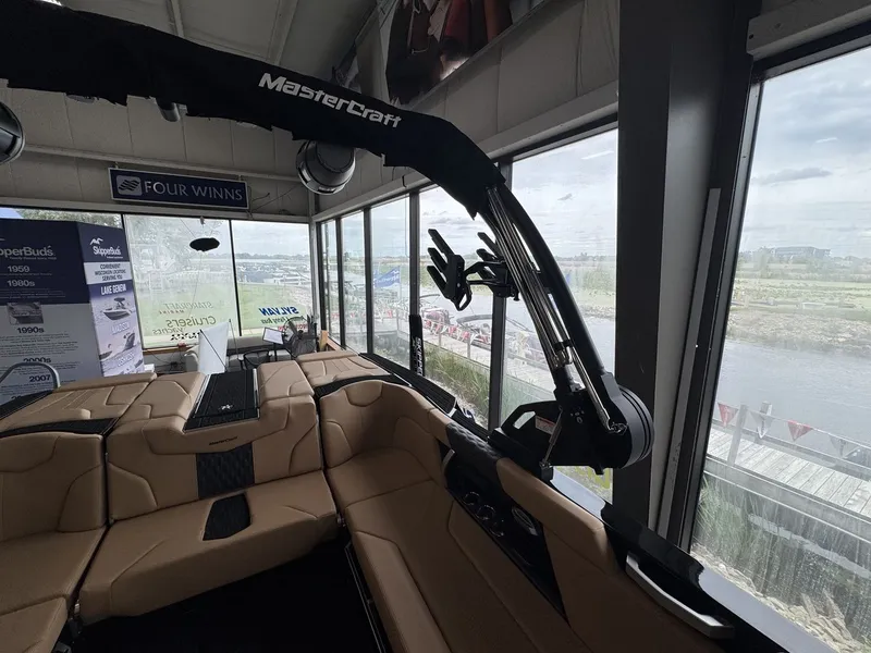Slide: The Image of Interior view of a MasterCraft XT22 boat with beige seating and a modern design. - 31