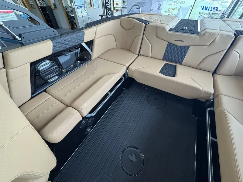 Slide: The Image of The image shows the interior of a 2026 MasterCraft XT22 with beige upholstery and black accents. - 7