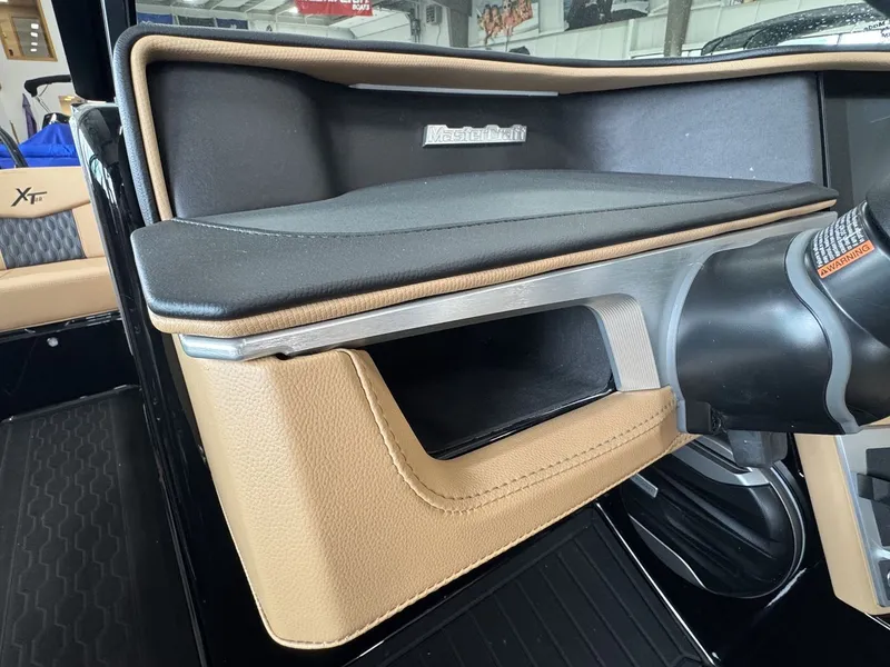 Slide: The Image of Interior view of a 2026 MasterCraft XT22 with sleek brown and black accents. - 13