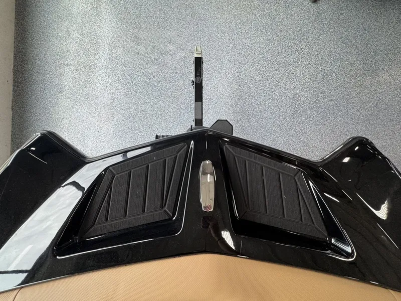 Slide: The Image of Top view of a MasterCraft XT22 boat's stern with a black deck and two steps. - 29
