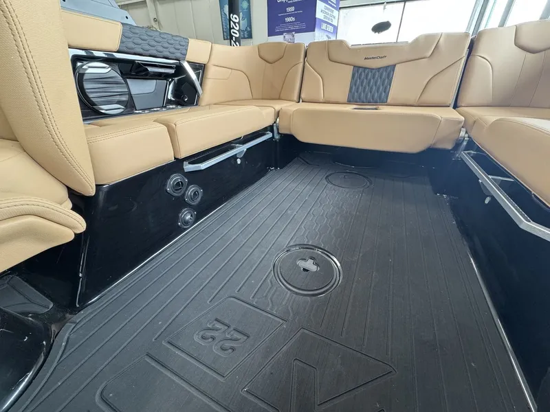 Slide: The Image of Interior of a 2026 MasterCraft XT22 with beige seating and black flooring. - 8