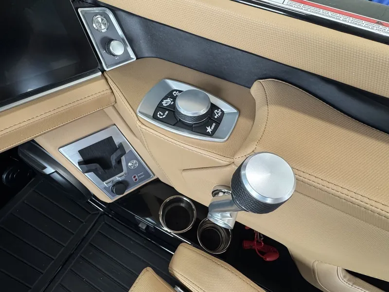 Slide: The Image of Close-up of the control area of a MasterCraft XT22 boat with modern controls. - 17