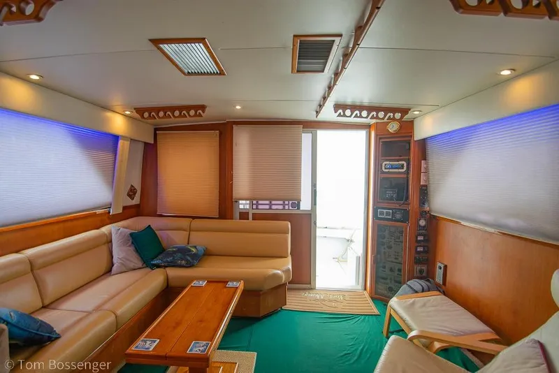 Slide: The Image of Luxurious interior of 1988 Chris-Craft 482 Convertible yacht with plush seating and modern amenities. - 12