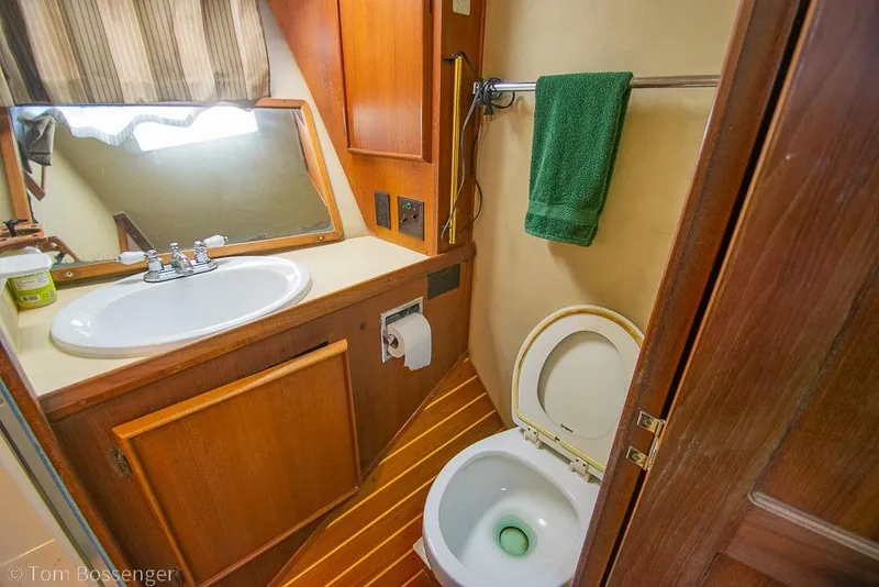 Slide: The Image of Bathroom interior of 1988 Chris-Craft 482 Convertible yacht with sink and toilet. - 19
