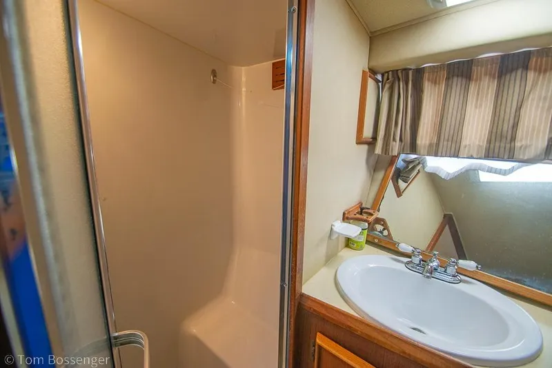 Slide: The Image of Bathroom interior of 1988 Chris-Craft 482 Convertible yacht with sink and shower. - 20