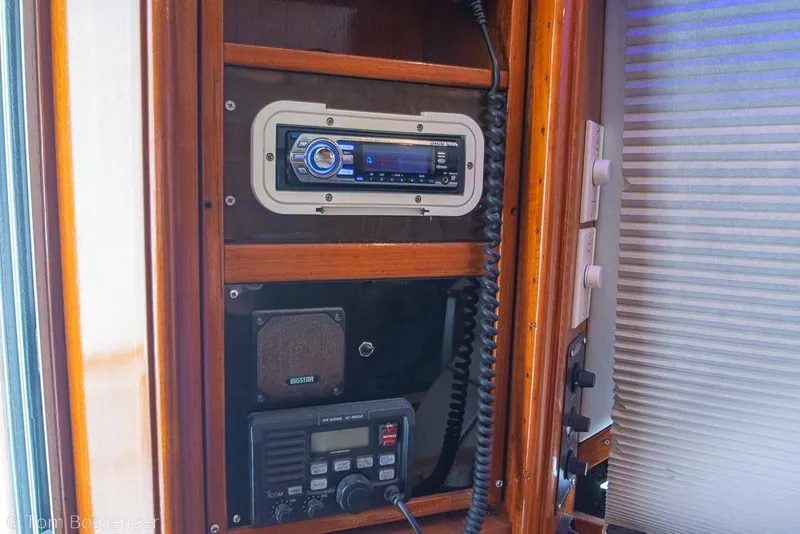 Slide: The Image of 1988 Chris-Craft 482 Convertible boat interior with radio and communication equipment. - 21