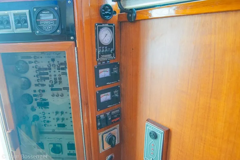 Slide: The Image of Control panel of a 1988 Chris-Craft 482 Convertible yacht with gauges and switches. - 23