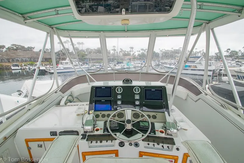 Slide: The Image of Cockpit view of 1988 Chris-Craft 482 Convertible yacht in marina setting. - 28