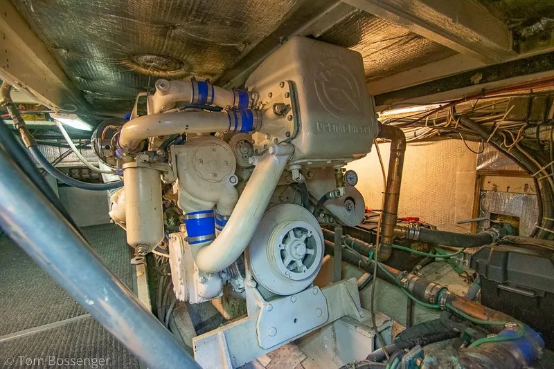 Slide: The Image of Engine room of a 1988 Chris-Craft 482 Convertible boat, showcasing detailed machinery. - 45
