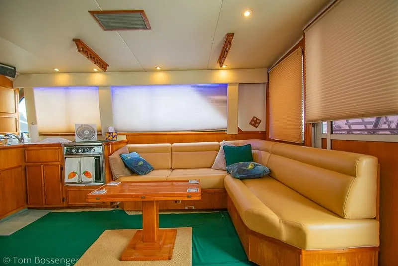 Slide: The Image of Luxurious interior of 1988 Chris-Craft 482 Convertible yacht with cozy seating and elegant decor. - 6