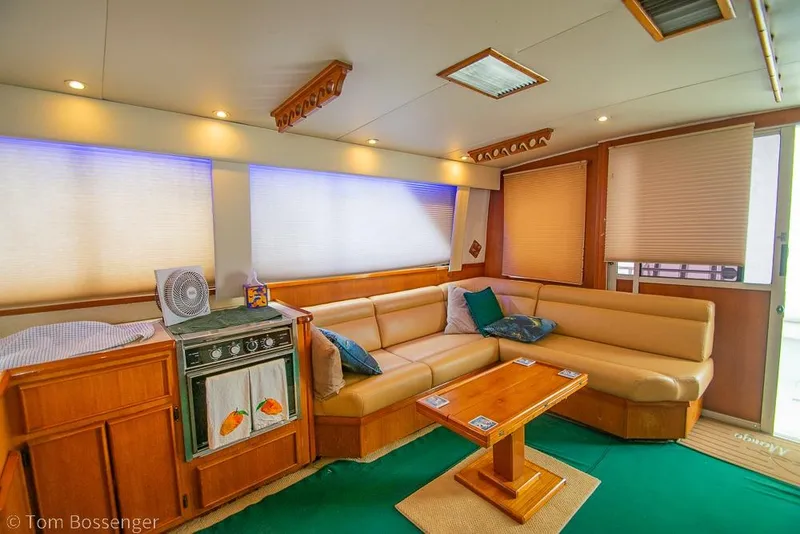 Slide: The Image of Luxurious interior of 1988 Chris-Craft 482 Convertible yacht with cozy seating and elegant decor. - 8