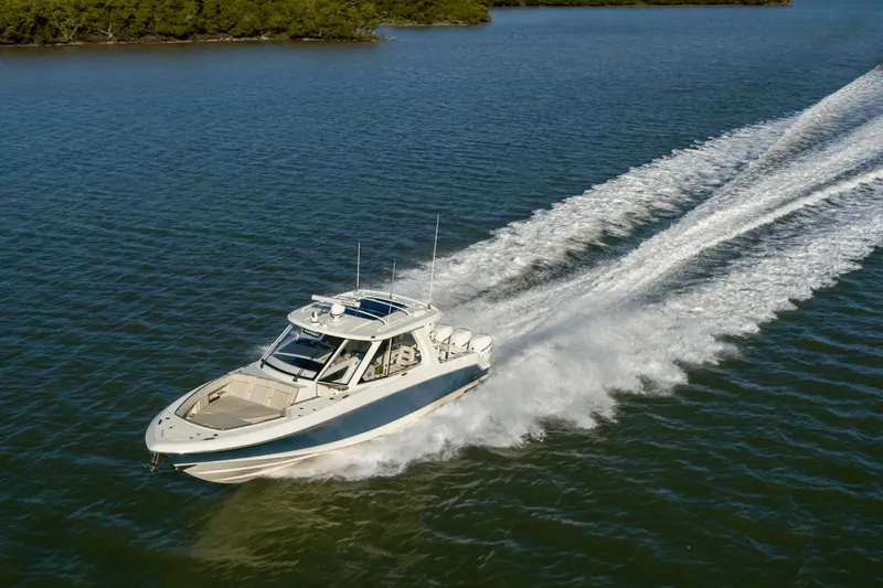 Slide: The Image of A 2027 Boston Whaler 380 Realm speeding across the water. - 2