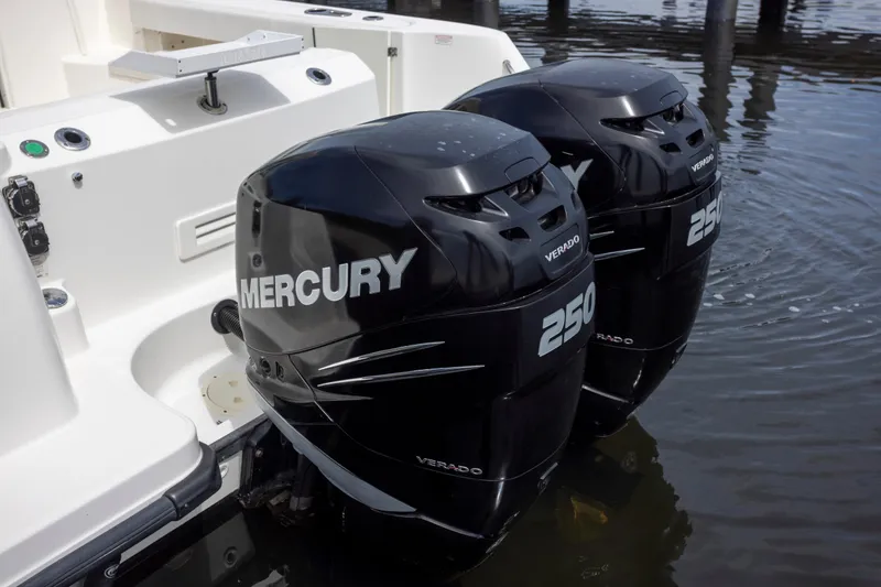 Slide: The Image of Twin Mercury 250 Verado engines on a 2014 Boston Whaler 315 Conquest boat. - 2
