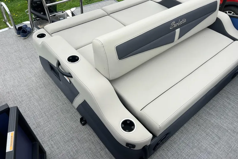 Slide: The Image of 2023 Barletta C22 boat seating with cup holders on gray deck. - 12