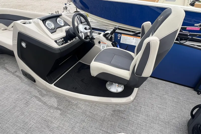 Slide: The Image of 2023 Barletta C22 boat cockpit with steering wheel and captain's chair. - 16